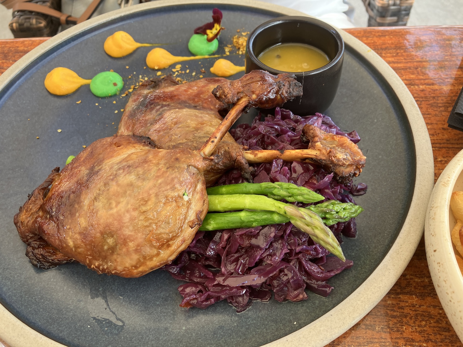 Duck leg with red cabbage and asparagus at Porto Antico Restaurant in Paphos